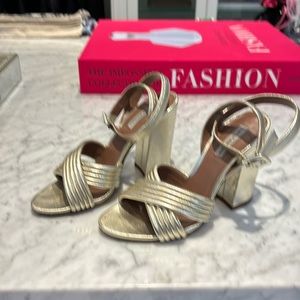 Tabatha Simmons gold ankle strapped heel